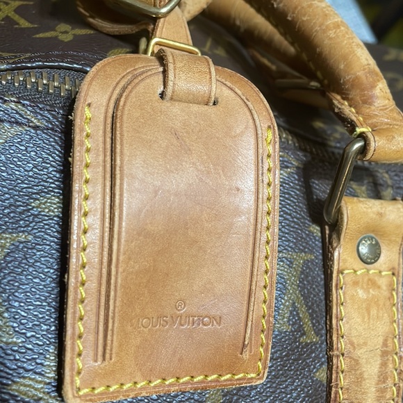 Authentic Louis Vuitton duffel. Tag, strap and lock and key included. - Picture 5 of 10